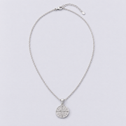 White gold compass necklace full length flat lay